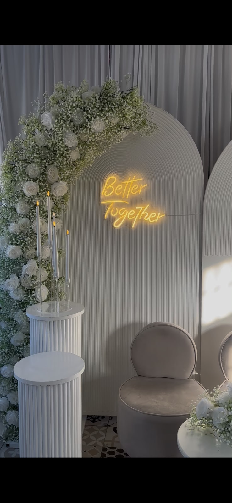Elegant white rose arch with Better Together neon sign